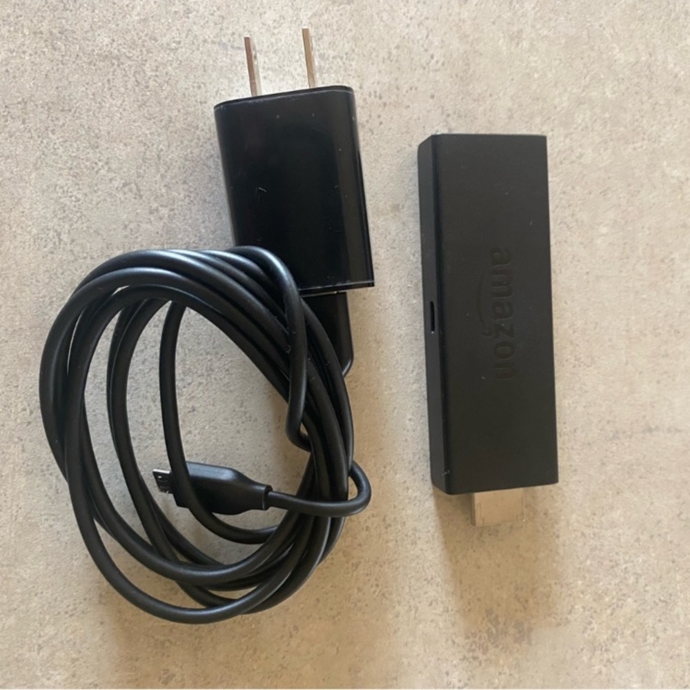Amazon Fire TV Stick with Charger and Remote.